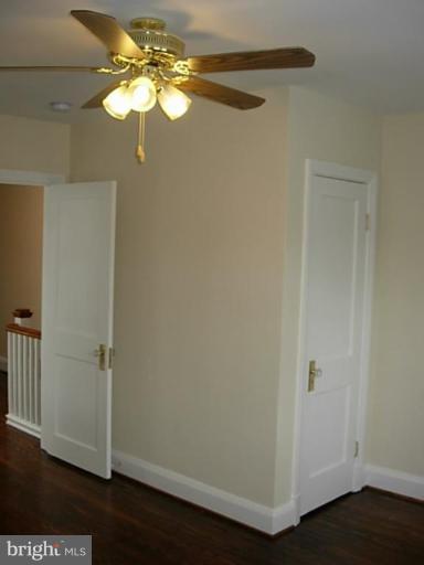 3718 Woodridge Road Baltimore, MD 21229 - Photo 12 of 18 an empty room with wooden floor