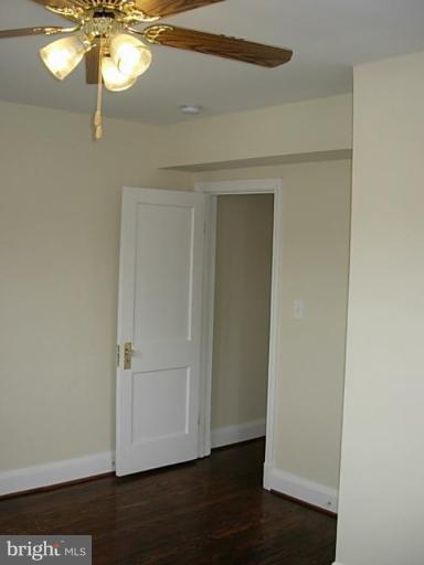 3718 Woodridge Road Baltimore, MD 21229 - Photo 14 of 18 a view of empty room with wooden floor and fan