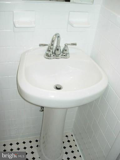 3718 Woodridge Road Baltimore, MD 21229 - Photo 16 of 18 a bathroom with a sink