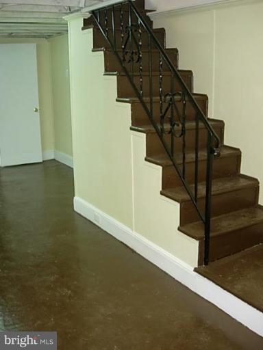 3718 Woodridge Road Baltimore, MD 21229 - Photo 18 of 18 a view of entryway and hall with wooden floor