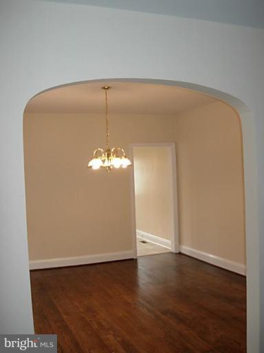 3718 Woodridge Road Baltimore, MD 21229 - Photo 7 of 18 a view of a livingroom with wooden floor