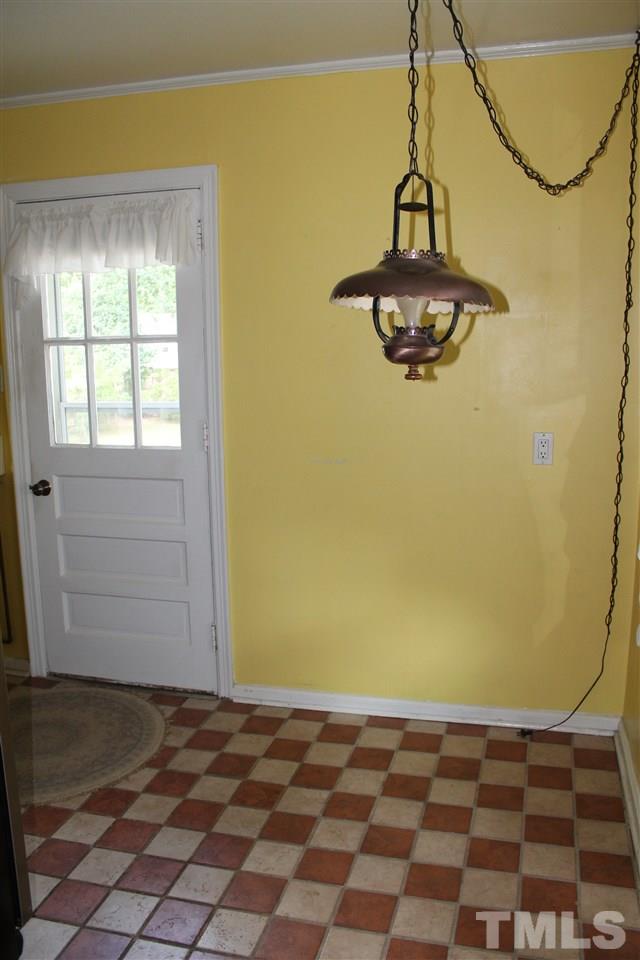1810 Bennett Street Raleigh, NC 27604 - Photo 14 of 25 a view of a big room with wooden floor and windows