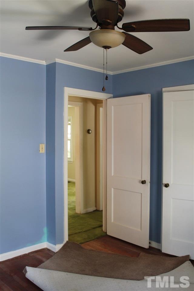 1810 Bennett Street Raleigh, NC 27604 - Photo 22 of 25 a view of a chandelier fan and wooden floor