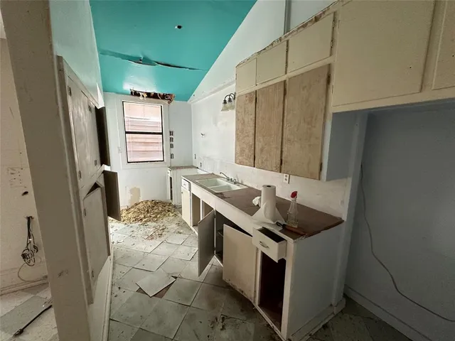 a utility room with cabinets