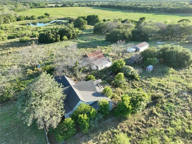 a view of a lake with a yard