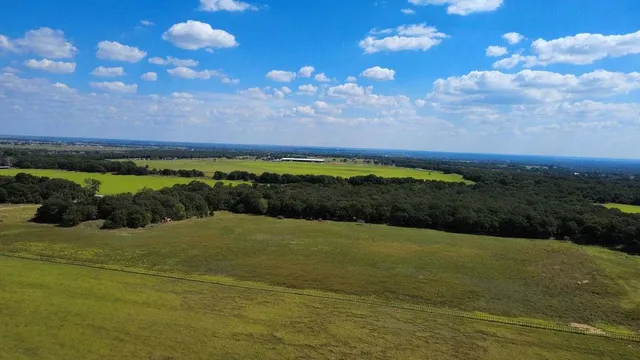 a view of a lake with a yard