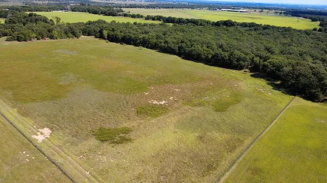 a view of a big yard with an outdoor space
