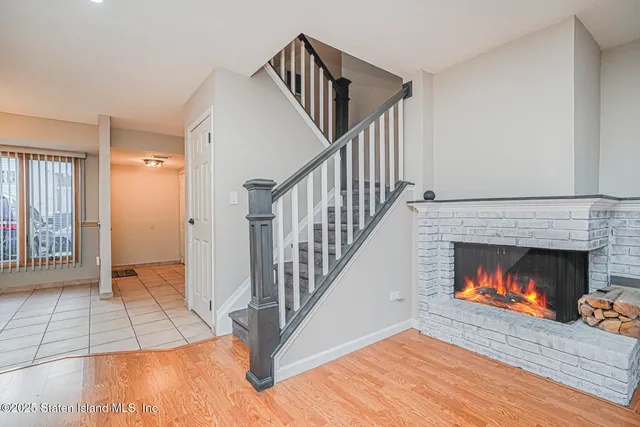 a view of an empty room and fire place