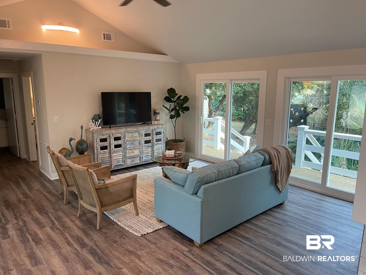 413 West Fort Morgan Road Gulf Shores, AL 36542 - Photo 6 of 29 Living room featuring dark wood-style floors, visible vents, and a ceiling fan