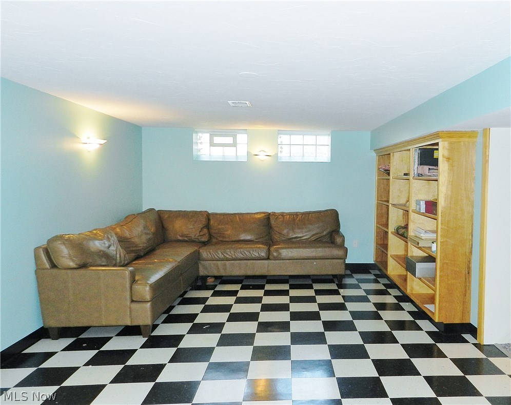 30065 Bolingbrook Road Pepper Pike, OH 44124 - Photo 22 of 33 A seating area at the opposite end of the lower level rec room. Through the doorway at right is another finished room, an ideal spot for watching TV or movies or playing video games.