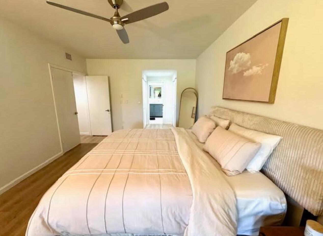 7744 La Mirada Drive Boca Raton, FL 33433 - Photo 14 of 33 a bedroom with a bed and a painting on the wall