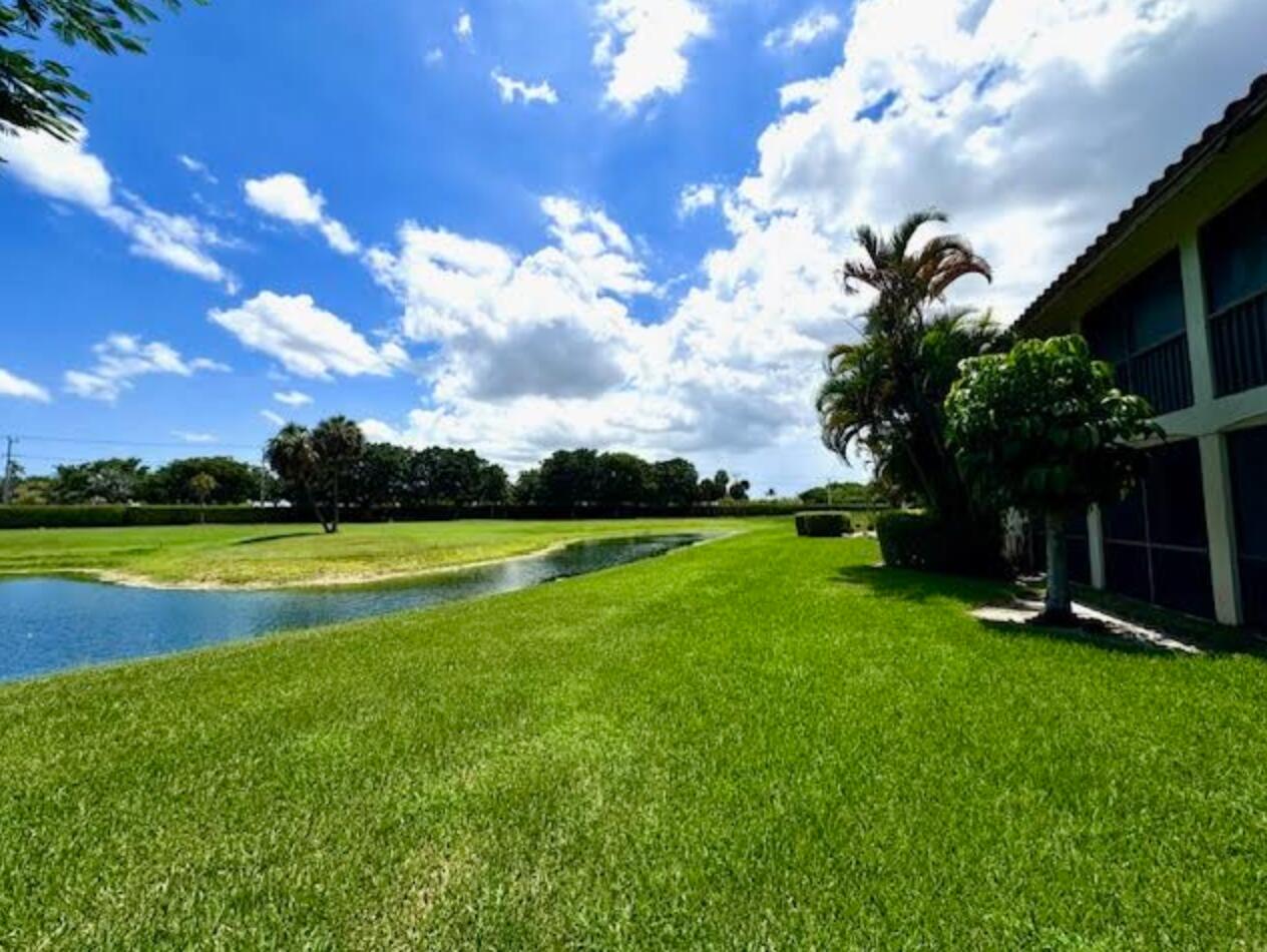 7744 La Mirada Drive Boca Raton, FL 33433 - Photo 28 of 33 a view of a golf course with a lake