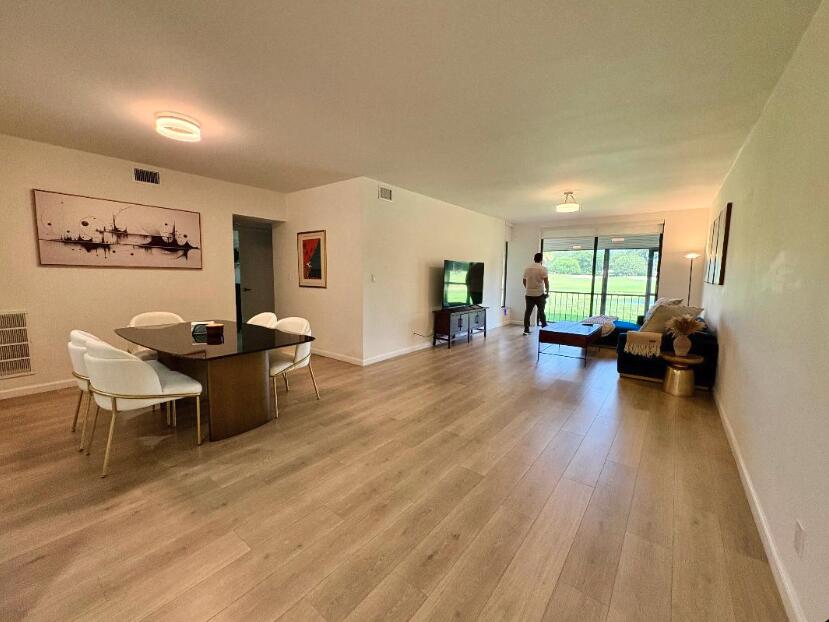 7744 La Mirada Drive Boca Raton, FL 33433 - Photo 7 of 33 a living room with furniture and a wooden floor