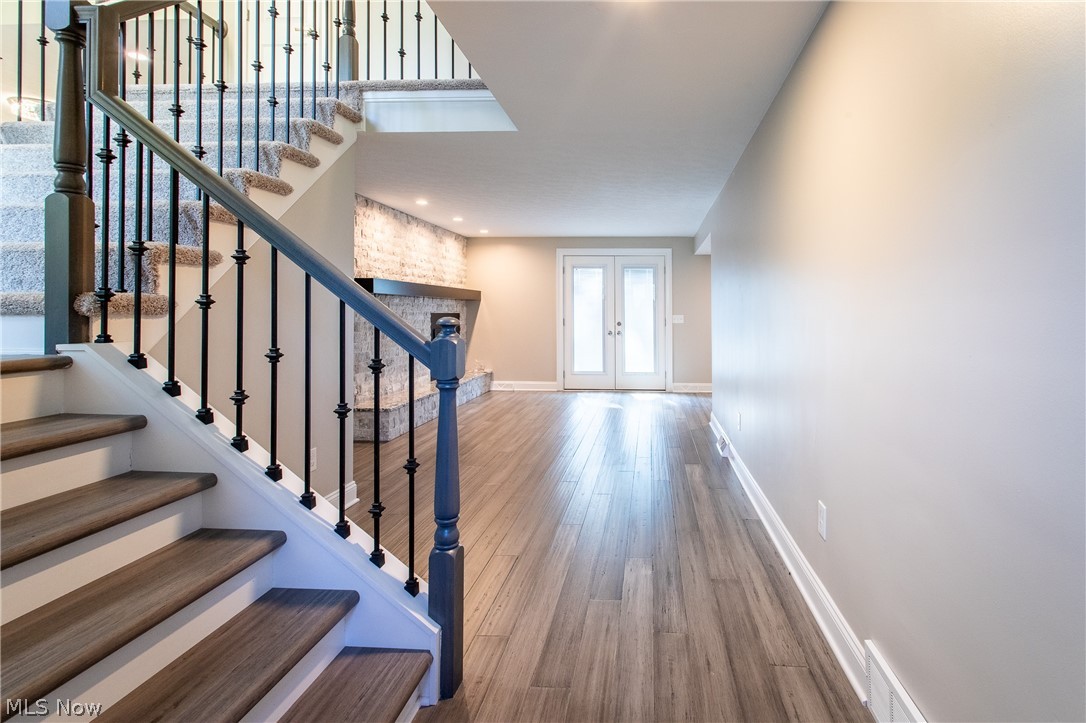 2728 Lander Road Cleveland, OH 44124 - Photo 19 of 50 Stairs with french doors and wood-type flooring