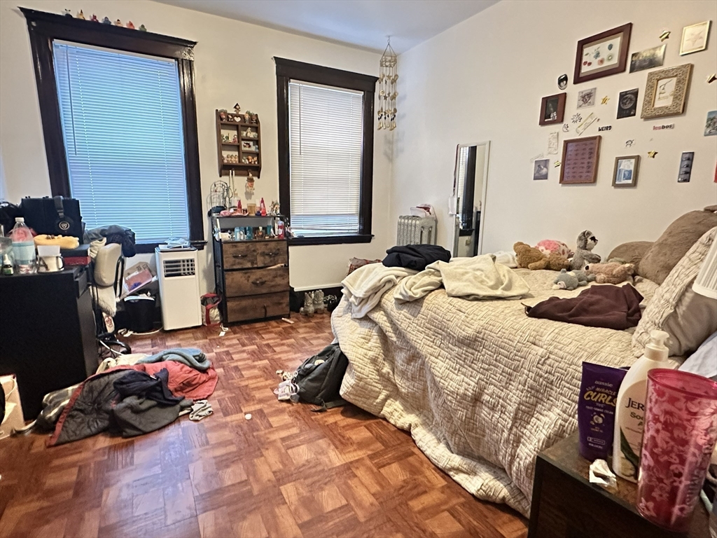 11 Chester Street, Unit 2 Boston, MA 02134 - Photo 5 of 10 a bedroom with a bed and a dresser