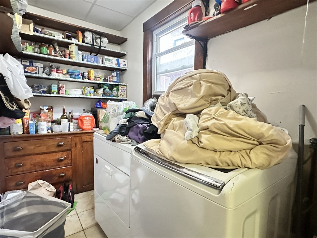11 Chester Street, Unit 2 Boston, MA 02134 - Photo 8 of 10 a bed sitting in a bedroom next to a window