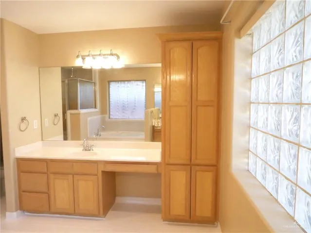 a bathroom with a bathtub and a sink