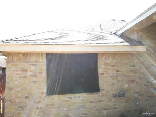 a view of a house with a tree