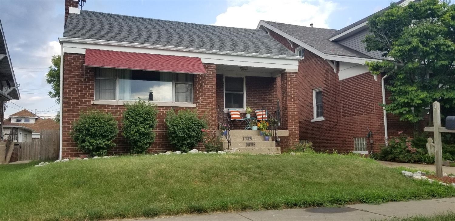 1739 Davis Avenue Whiting, IN 46394 - Photo 3 of 10 a front view of a house with garden