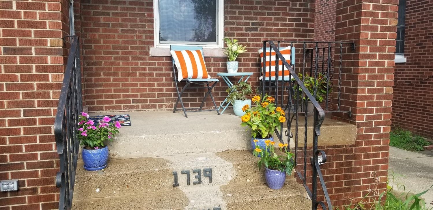 1739 Davis Avenue Whiting, IN 46394 - Photo 5 of 10 a potted plant sitting on a brick floor