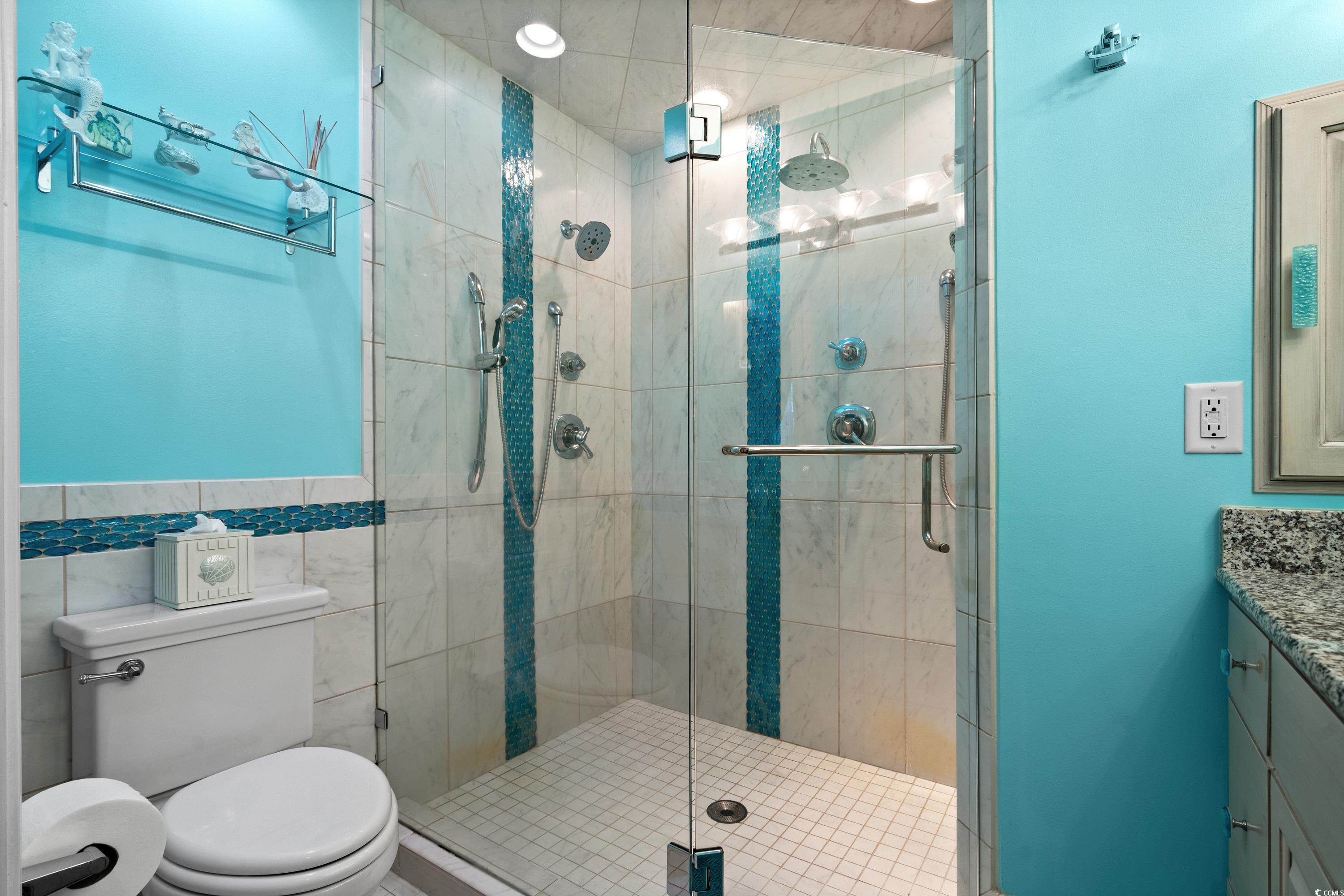 2621 Corn Pile Road Myrtle Beach, SC 29588 - Photo 23 of 40 Bathroom featuring a shower with door, vanity, til