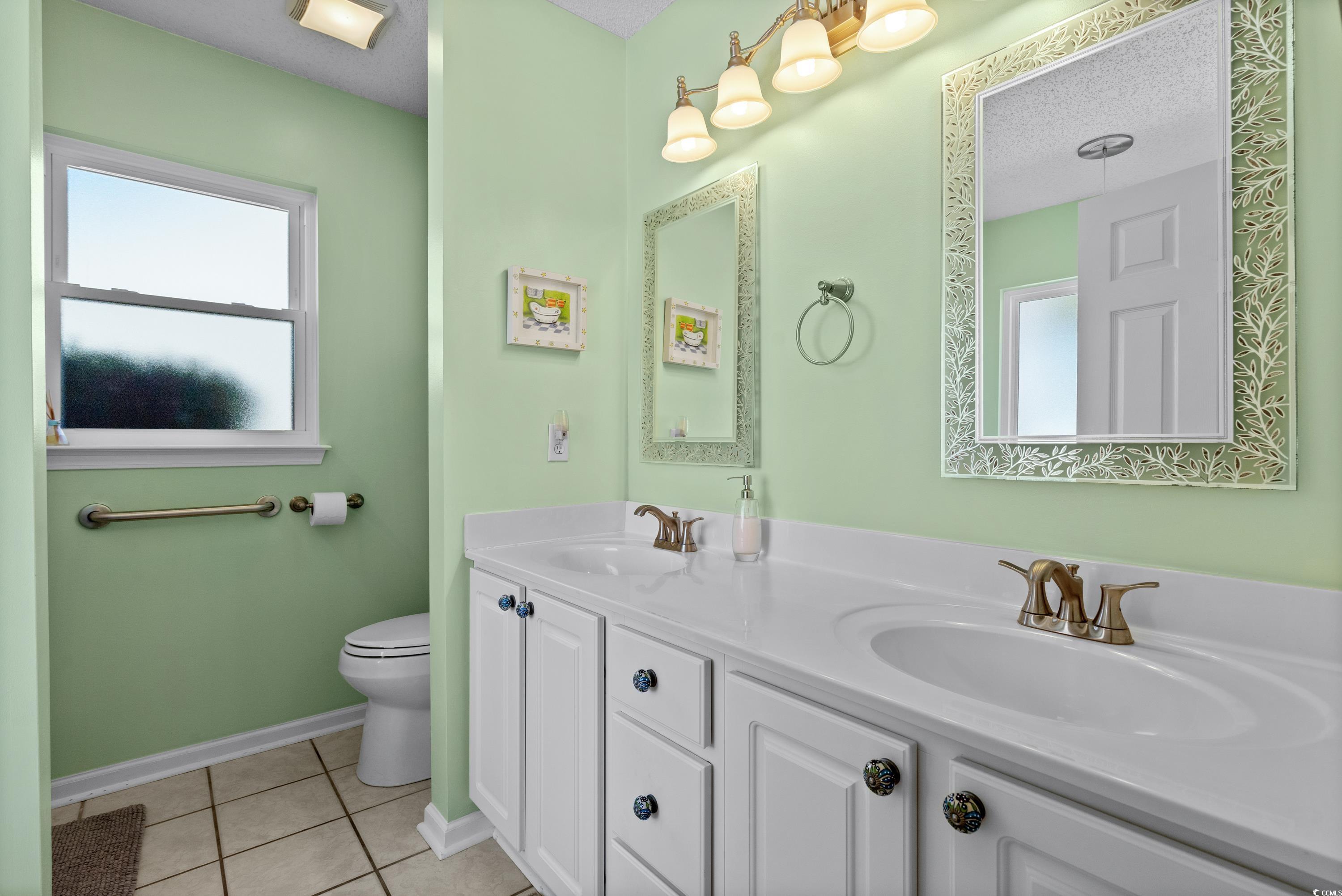2621 Corn Pile Road Myrtle Beach, SC 29588 - Photo 26 of 40 Bathroom with tile patterned flooring, vanity, and