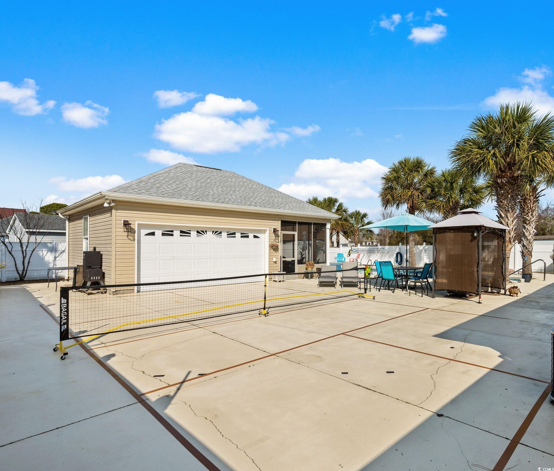 2621 Corn Pile Road Myrtle Beach, SC 29588 - Photo 34 of 40 View of front of house featuring a garage and a su