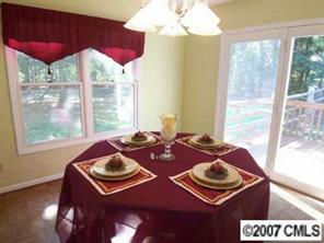 2425 Cherry Lane Denver, NC 28037 - Photo 2 of 8 a bedroom with furniture and a large window