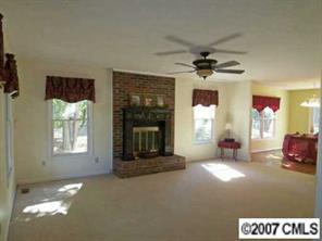 2425 Cherry Lane Denver, NC 28037 - Photo 3 of 8 a living room with furniture window and fireplace