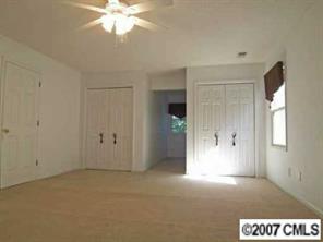 2425 Cherry Lane Denver, NC 28037 - Photo 6 of 8 a view of an empty room with a window