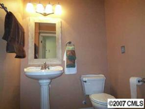 2425 Cherry Lane Denver, NC 28037 - Photo 7 of 8 a bathroom with a sink toilet and mirror