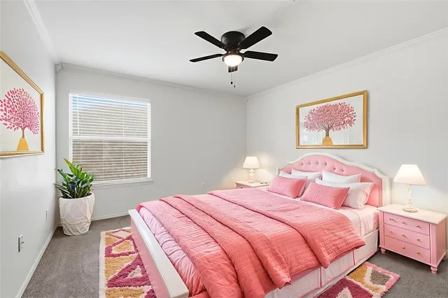 a bedroom with a bed and a painting on the wall