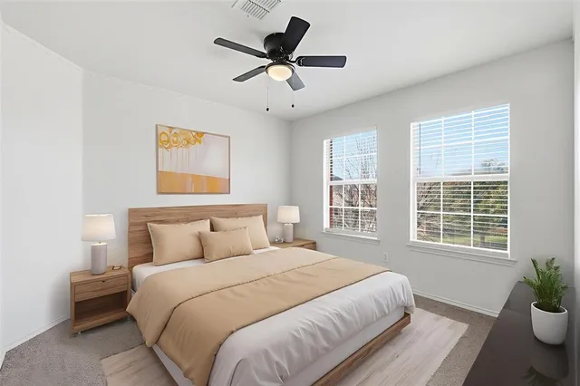 a bedroom with a bed and window