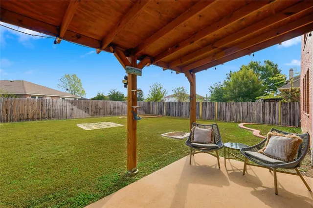 a view of a chairs and table in the patio