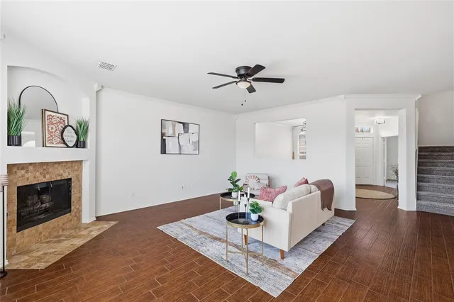 a living room with furniture and a fireplace