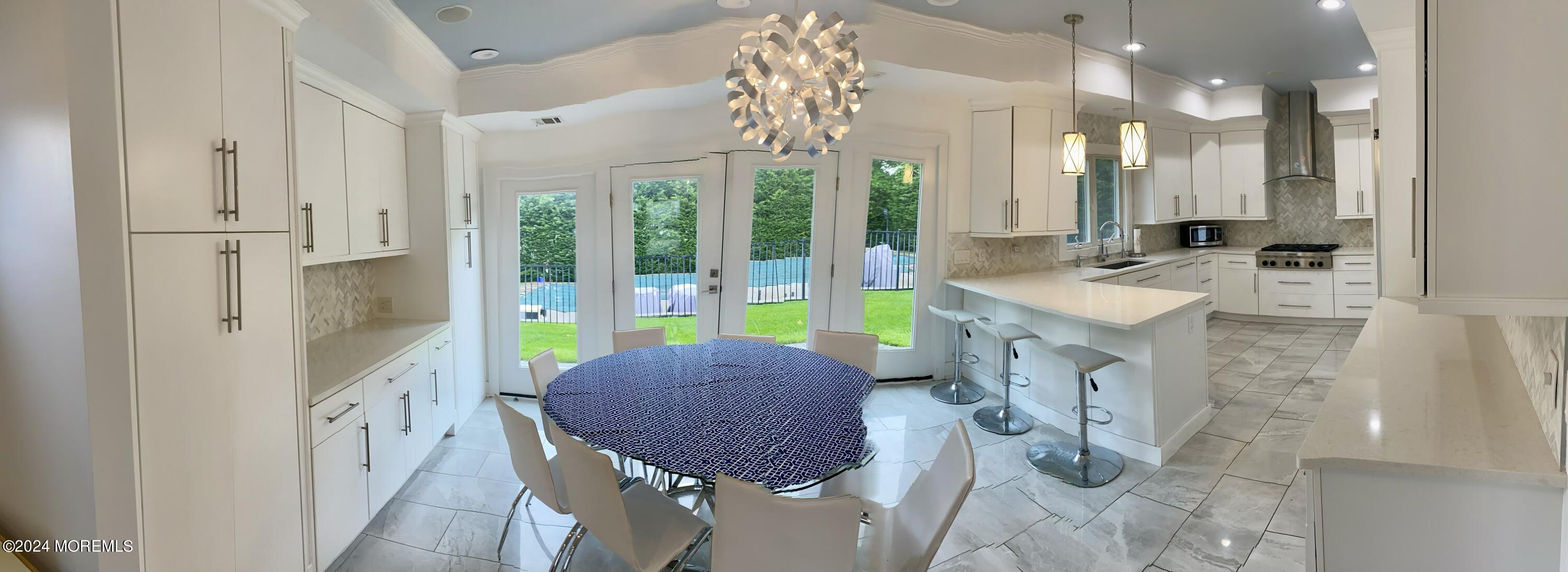 229 Lockwood Avenue Long Branch, NJ 07740 - Photo 4 of 24 a spacious bathroom with a tub sink and glass door