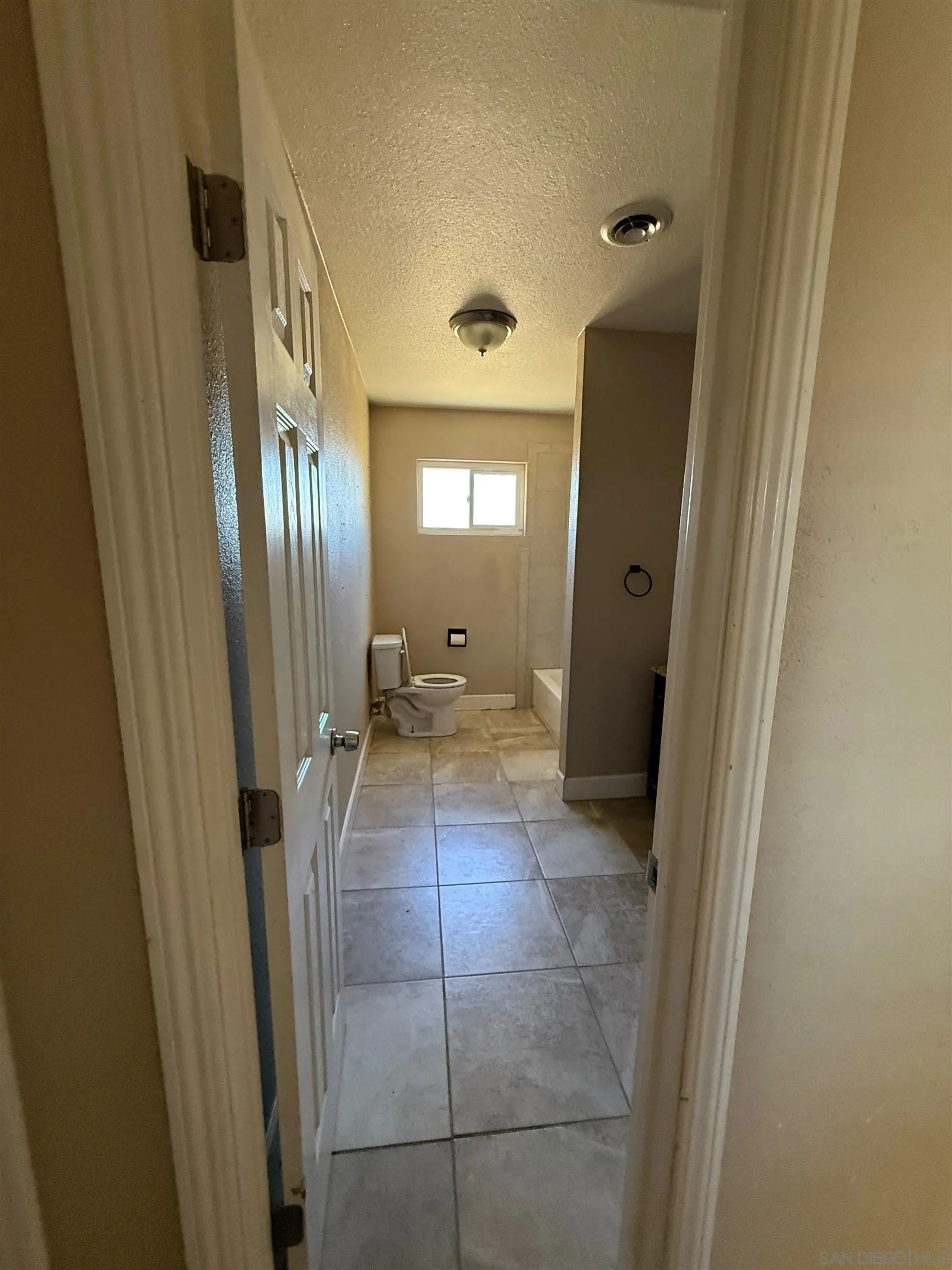 23273 Marsh Creek Road Brentwood, CA 94513 - Photo 7 of 8 a view of a hallway with wooden floor and a living room