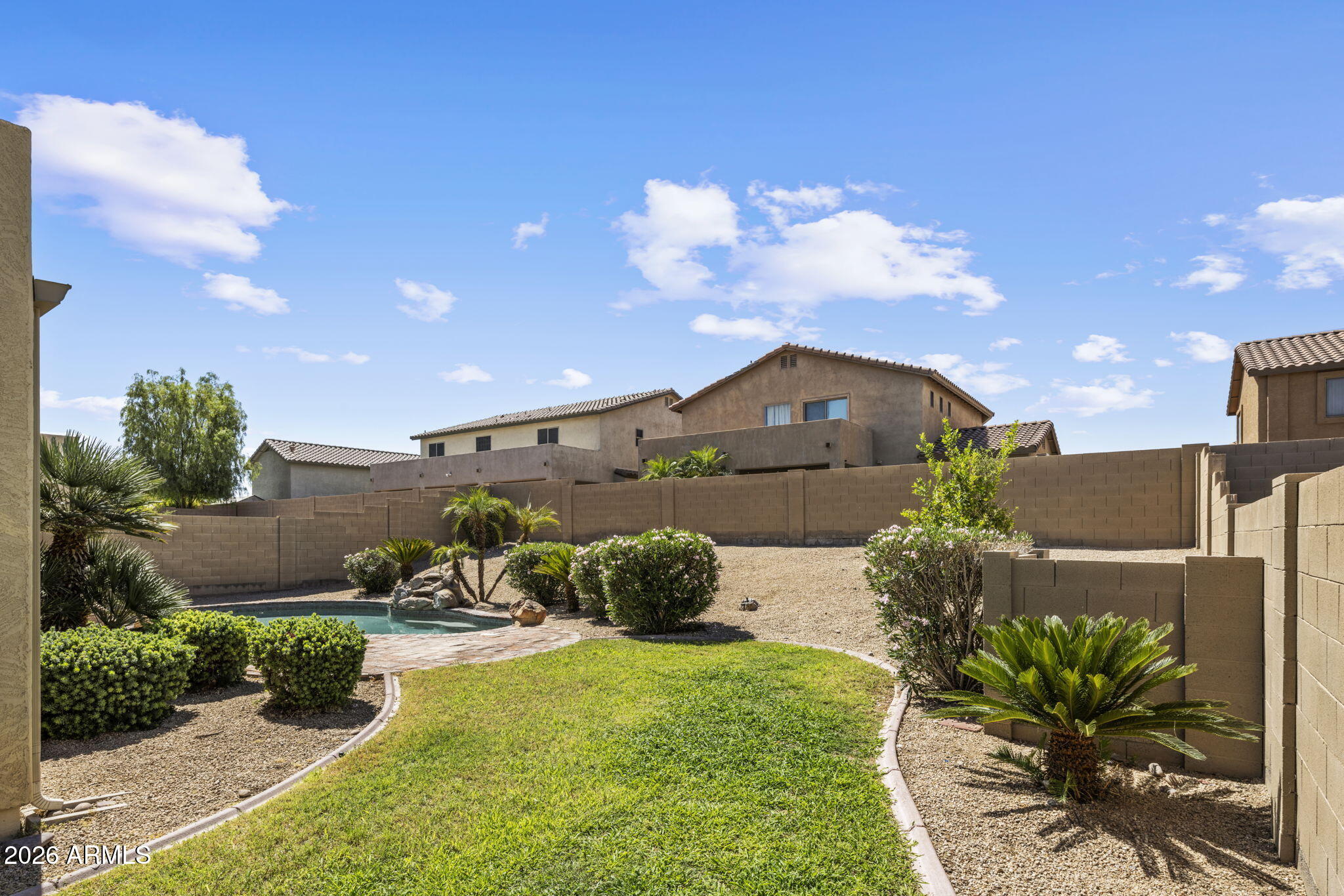 5121 West Beverly Road Laveen, AZ 85339 - Photo 9 of 32 a front view of a house with garden