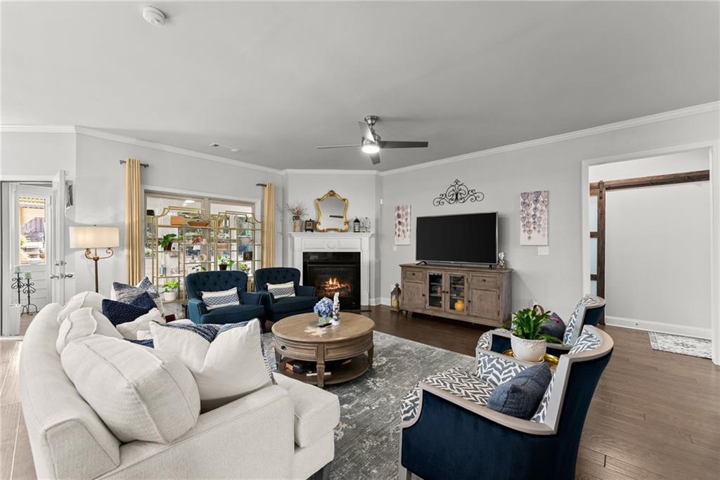 527 Gadwall Circle Jefferson, GA 30549 - Photo 15 of 48 a living room with furniture a flat screen tv and a fireplace