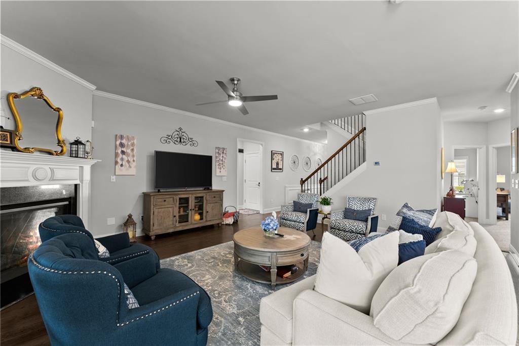 527 Gadwall Circle Jefferson, GA 30549 - Photo 16 of 48 a living room with furniture and a flat screen tv