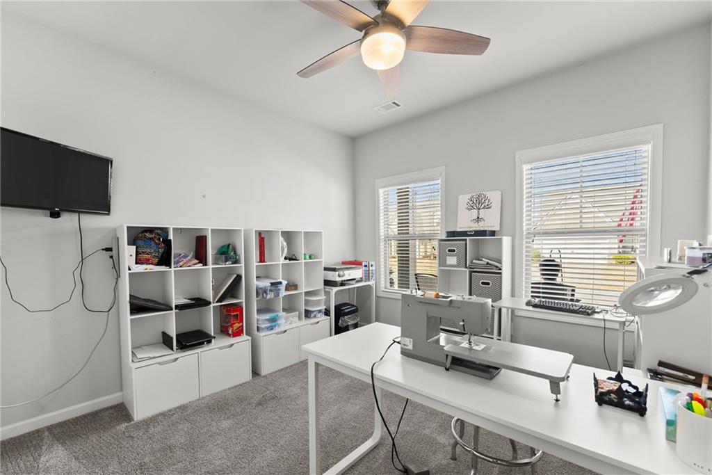 527 Gadwall Circle Jefferson, GA 30549 - Photo 26 of 48 a work room with furniture and a flat screen tv