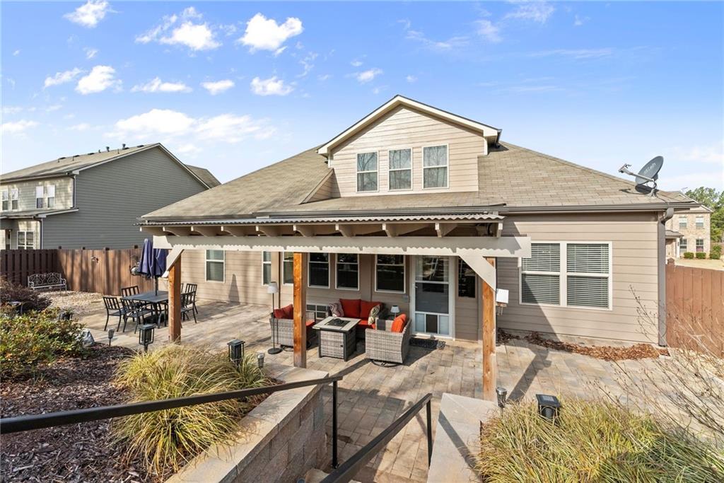 527 Gadwall Circle Jefferson, GA 30549 - Photo 36 of 48 a view of a house with large windows and a table