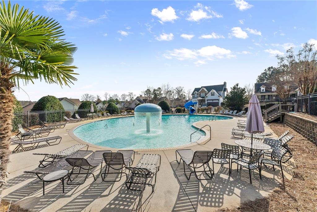 527 Gadwall Circle Jefferson, GA 30549 - Photo 46 of 48 a view of a swimming pool with a patio and fire pit