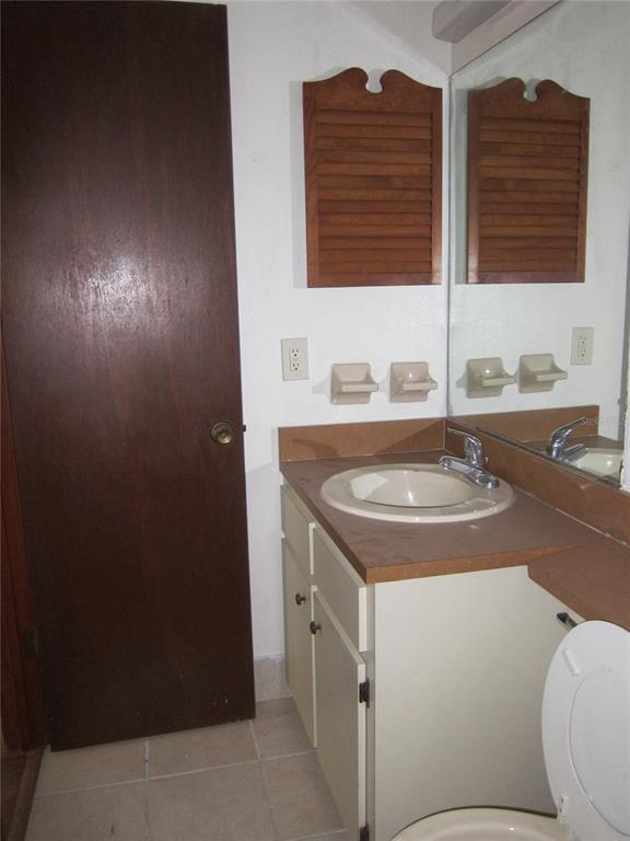 1209 Southwest 80th Drive Gainesville, FL 32607 - Photo 15 of 32 a bathroom with a sink and a vanity
