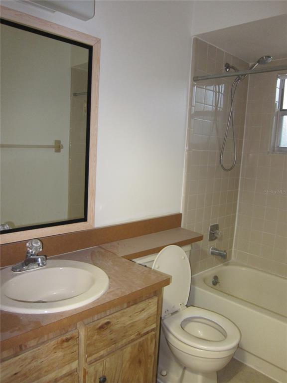 1209 Southwest 80th Drive Gainesville, FL 32607 - Photo 23 of 32 a bathroom with a sink toilet and shower