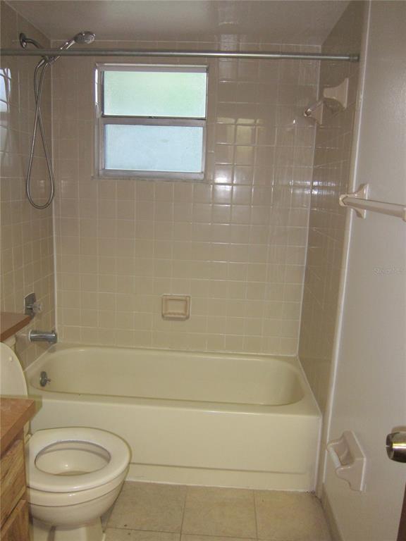 1209 Southwest 80th Drive Gainesville, FL 32607 - Photo 24 of 32 a bathroom with a toilet and a shower
