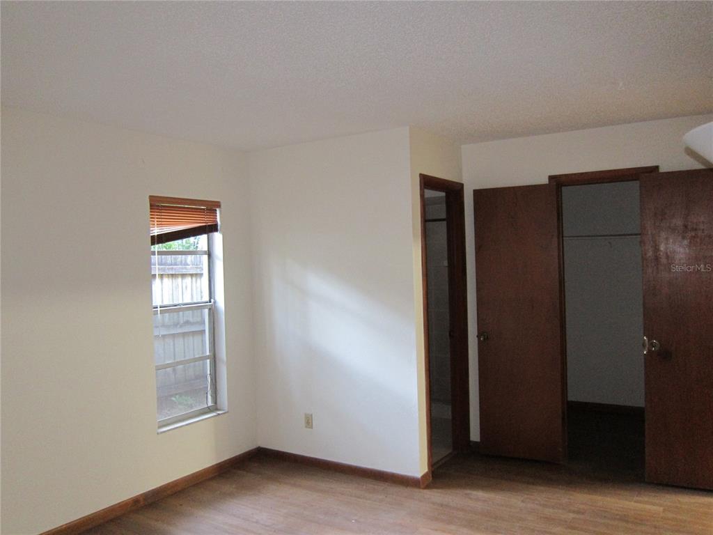 1209 Southwest 80th Drive Gainesville, FL 32607 - Photo 10 of 32 an empty room with windows and closet