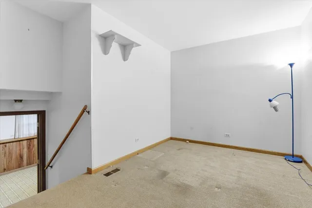 a view of an empty room and entryway