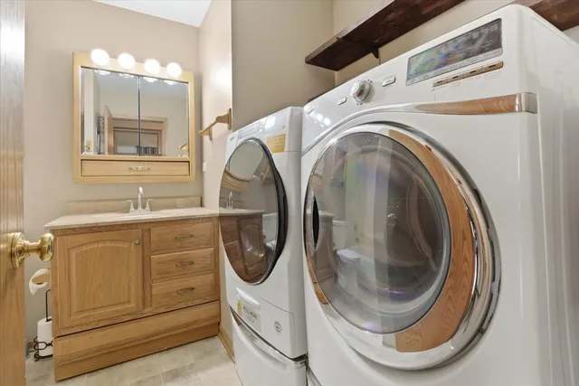 a bathroom with a sink a toilet and a shower
