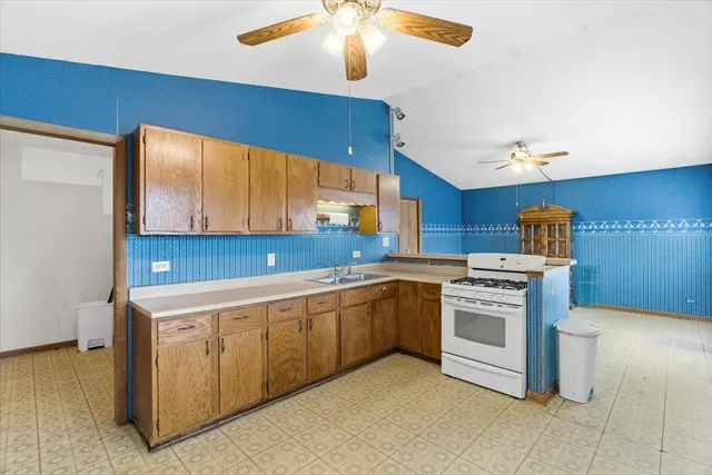 a kitchen that has a sink and a stove